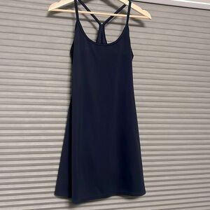 Quince Navy Racerback Travel Dress with built in shorts and hidden pocket.